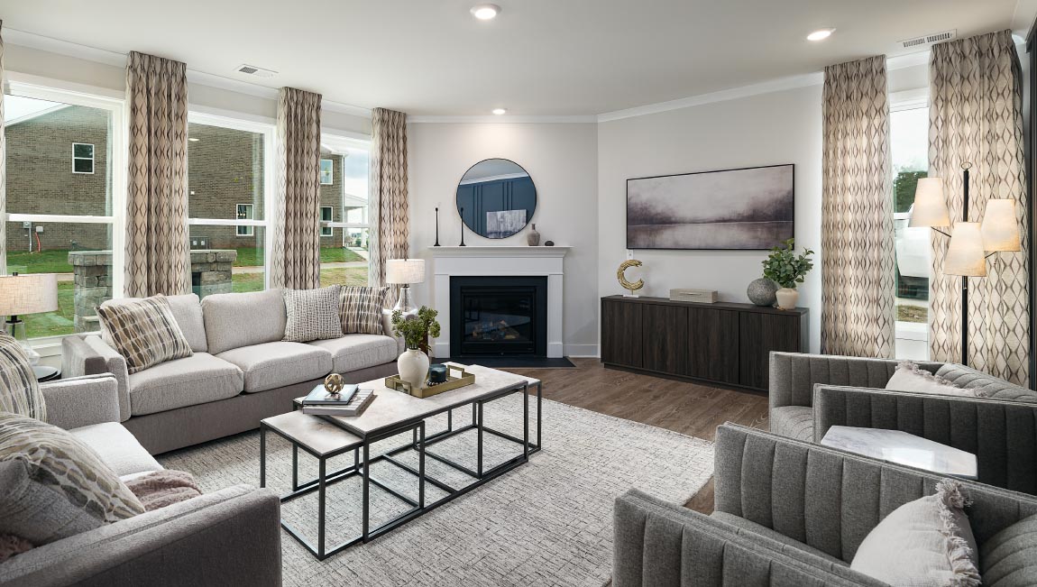 Open family room with fireplace and windows