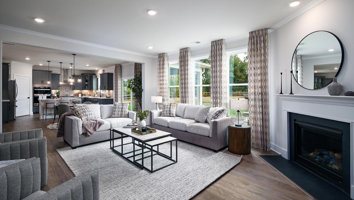 Open family room with fireplace and windows