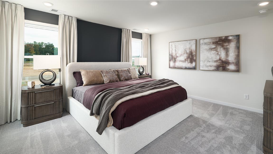 Primary bedroom, carpeted, with three windows