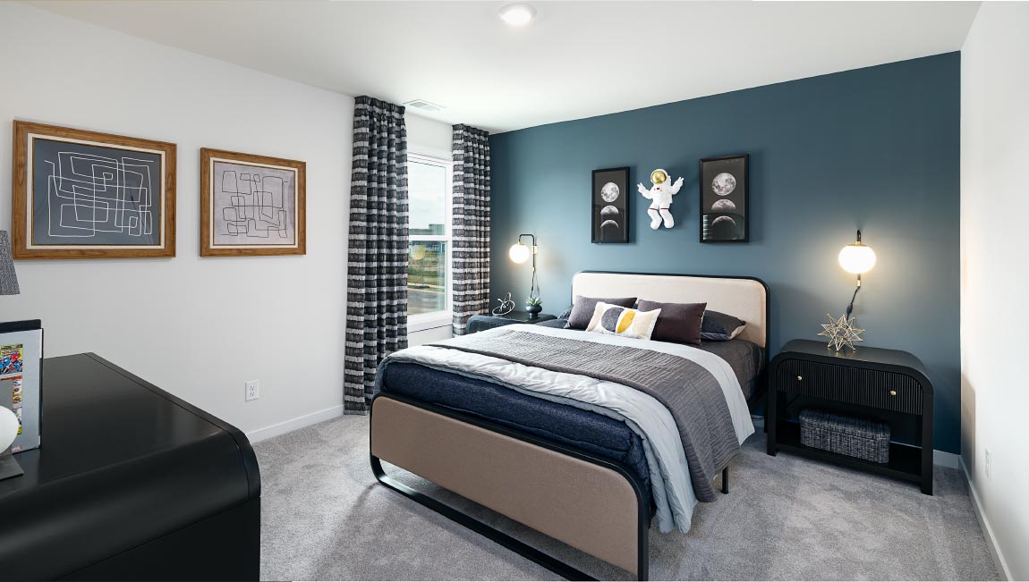 Carpeted bedroom with windows