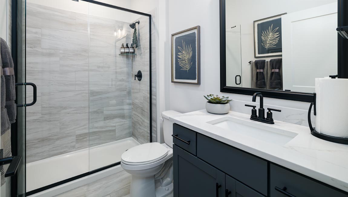 Bathroom with single sink and standing glass shower