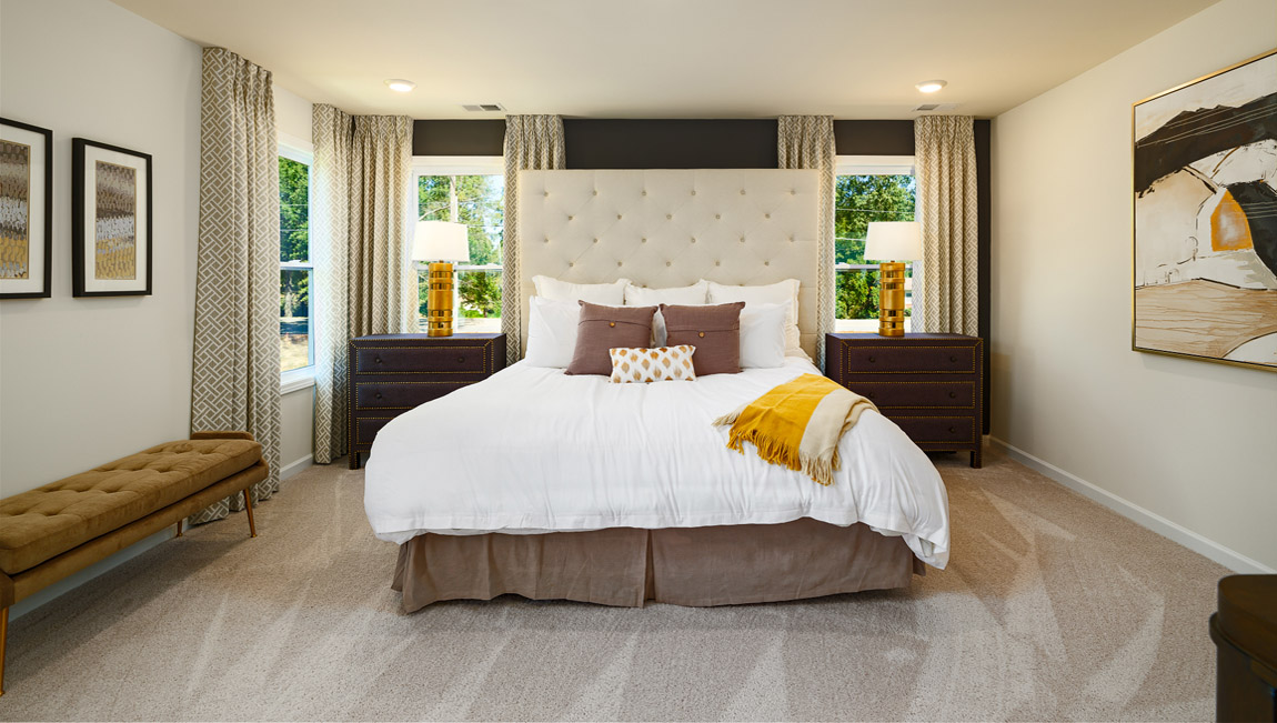 Primary bedroom, carpeted, with three windows