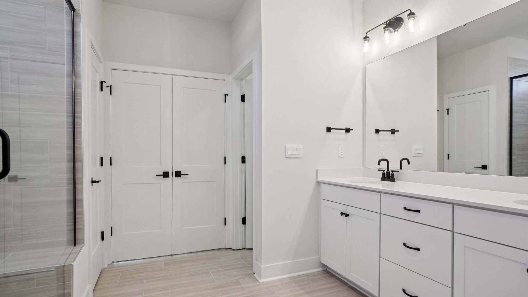 Primary bathroom with standing glass shower