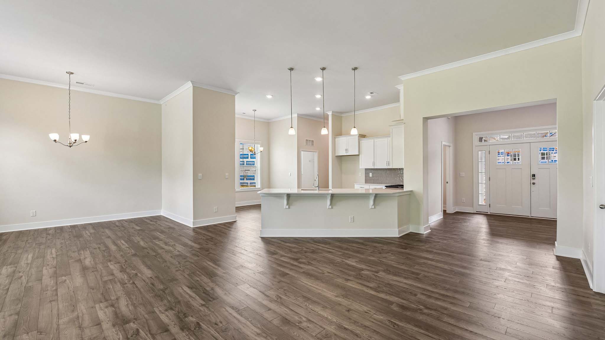 Kitchen and island with cabinets and stainless steel appliances