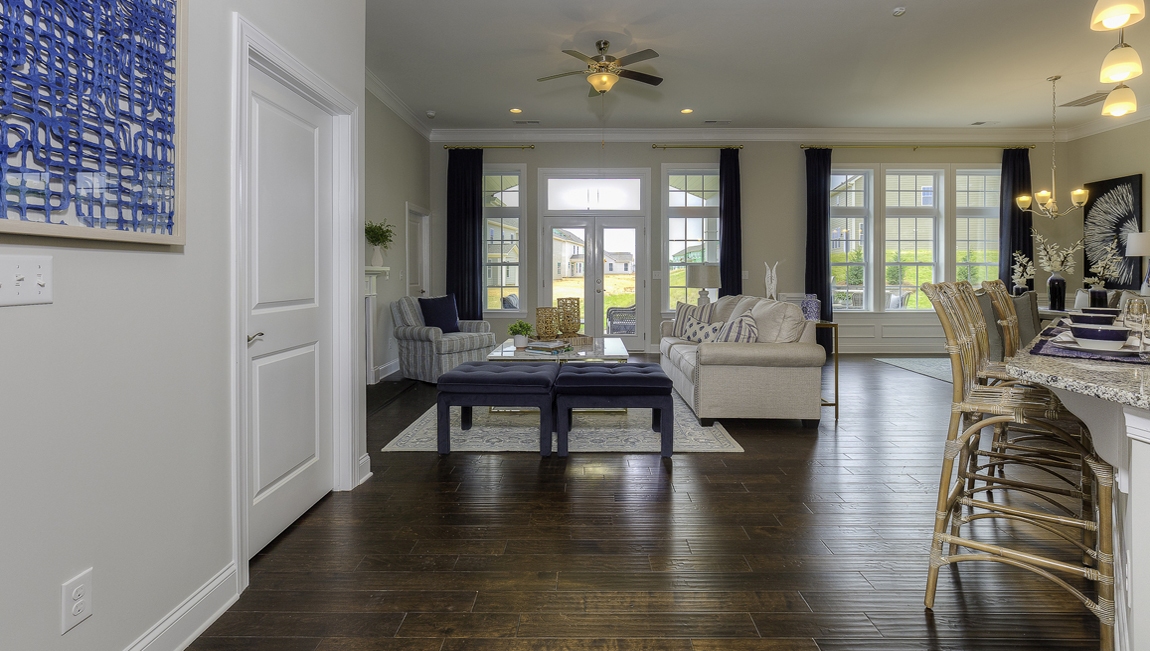 Open family room beside kitchen with fireplace