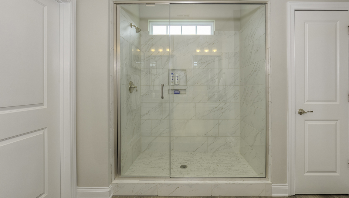 Primary bathroom with large glass door shower