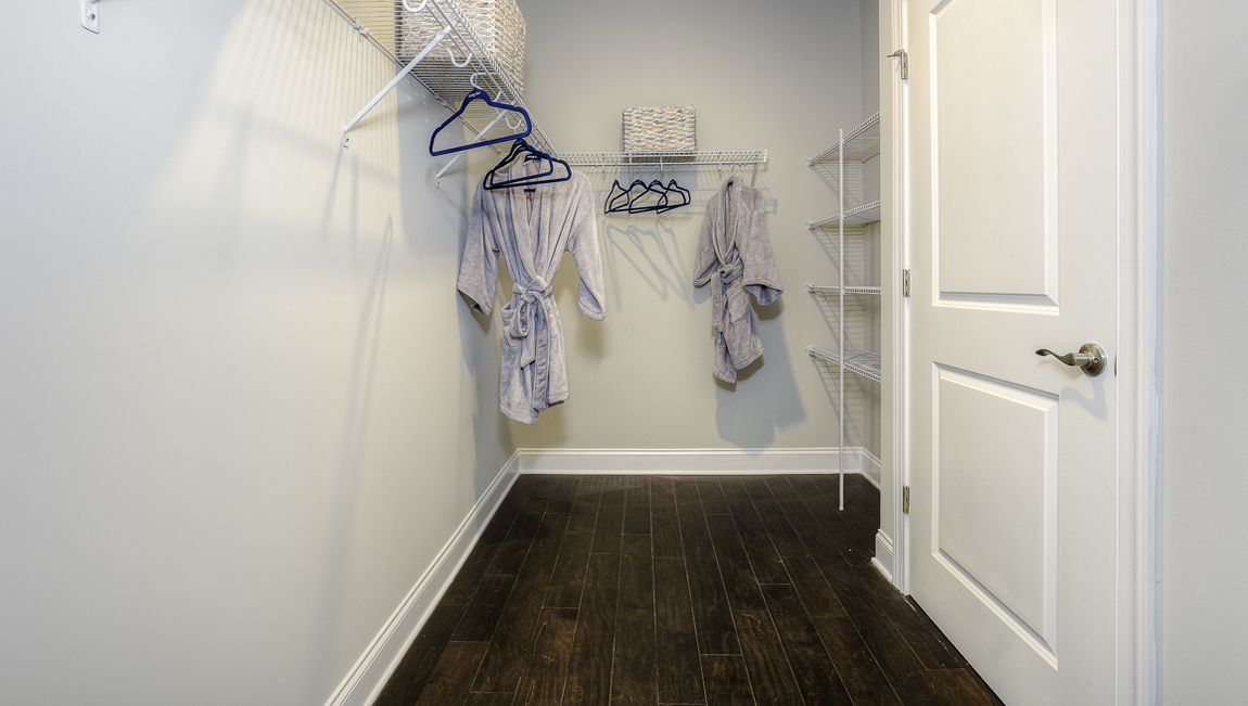 Primary bedroom walk in closet