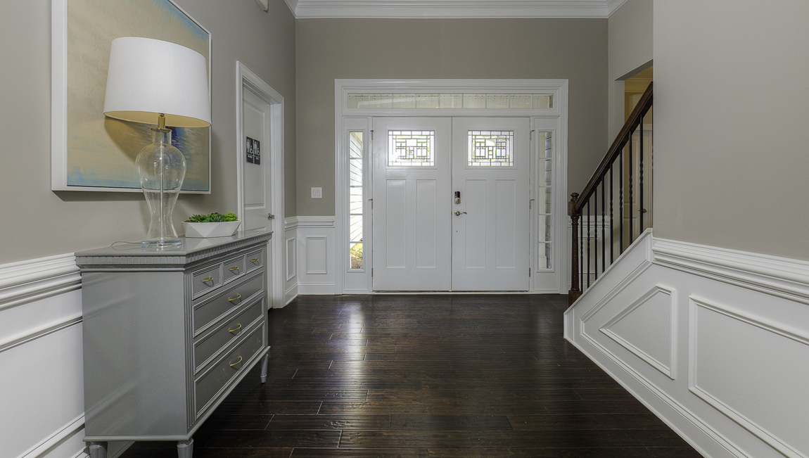 welcoming foyer with double front doors