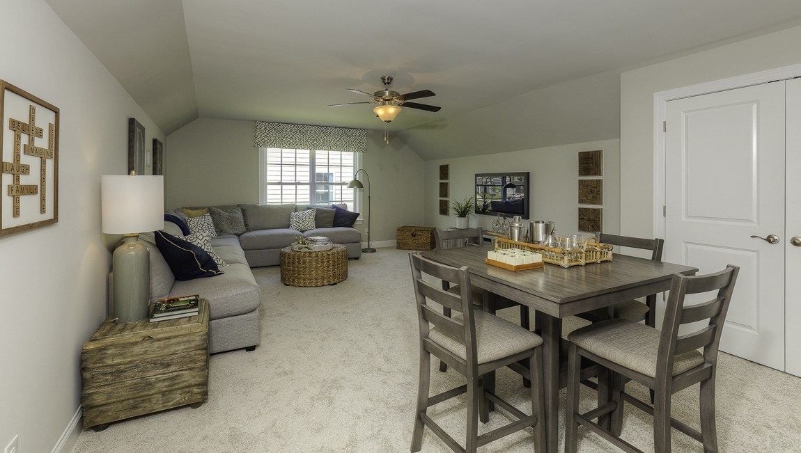 Carpeted bedroom with large windows