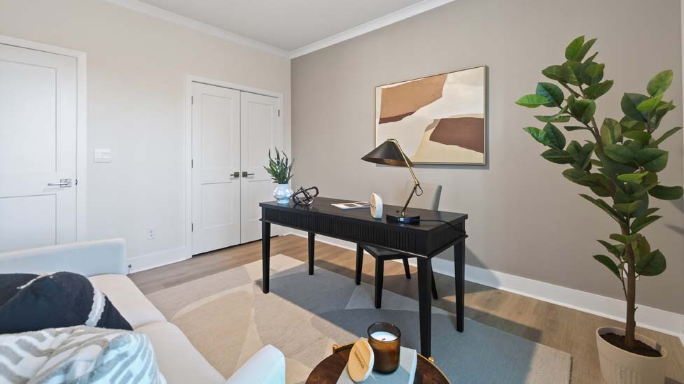 Open concept family room with large windows and fireplace