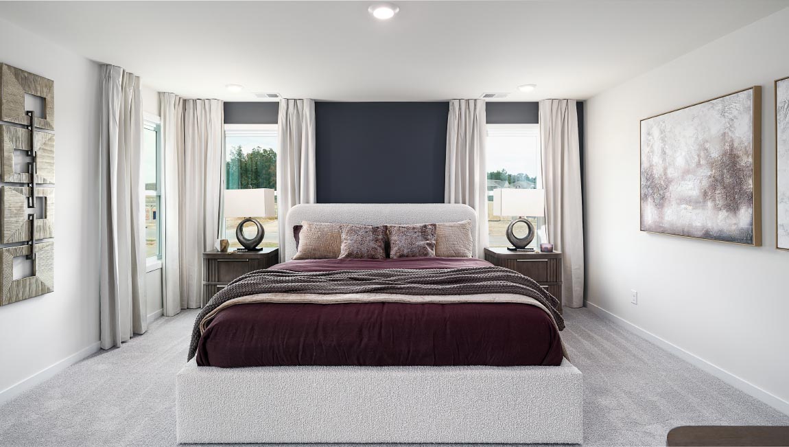 Primary bedroom, carpeted, with three windows