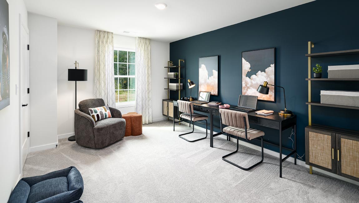 Carpeted bedroom with windows