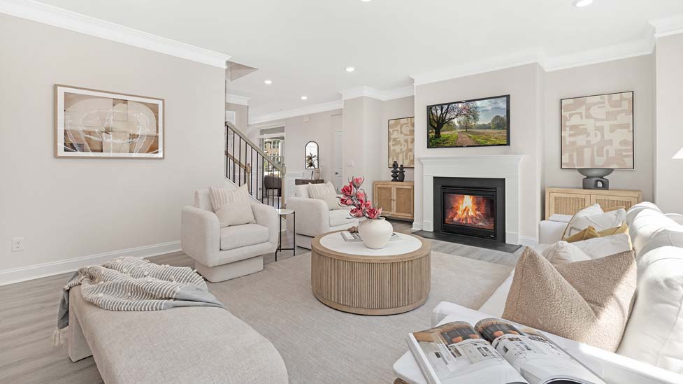 Modern, open-concept Family room with wood floors, fireplace, and large windows