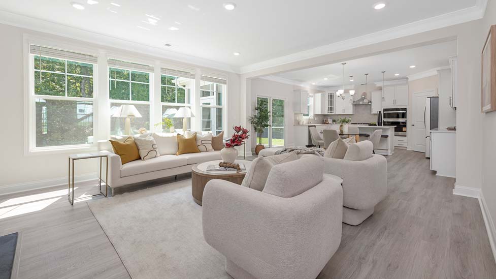 Modern, open-concept Family room with wood floors, fireplace, and large windows