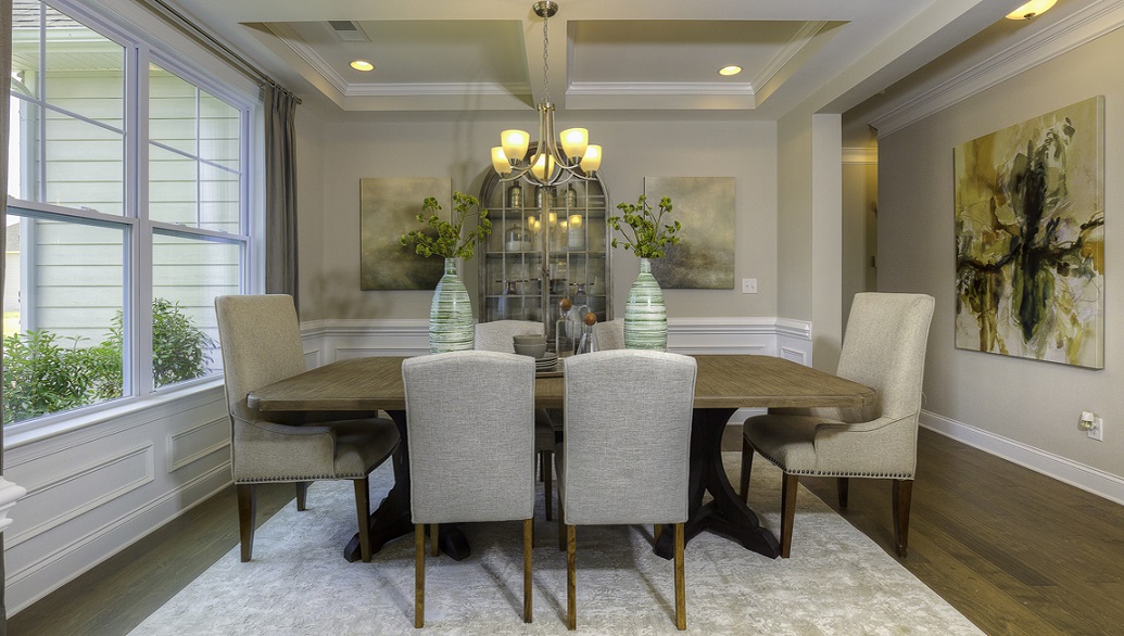 Dining room with wood floors and large window