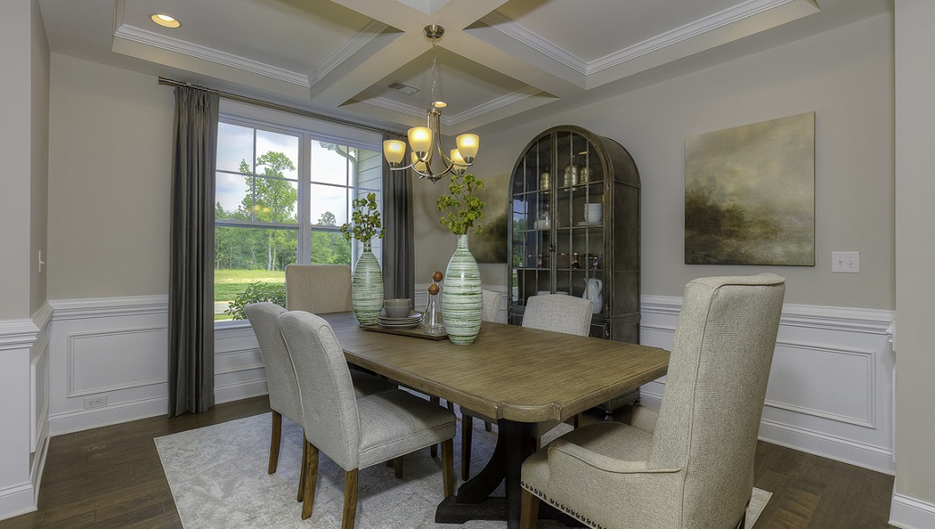 Dining room with wood floors and large window