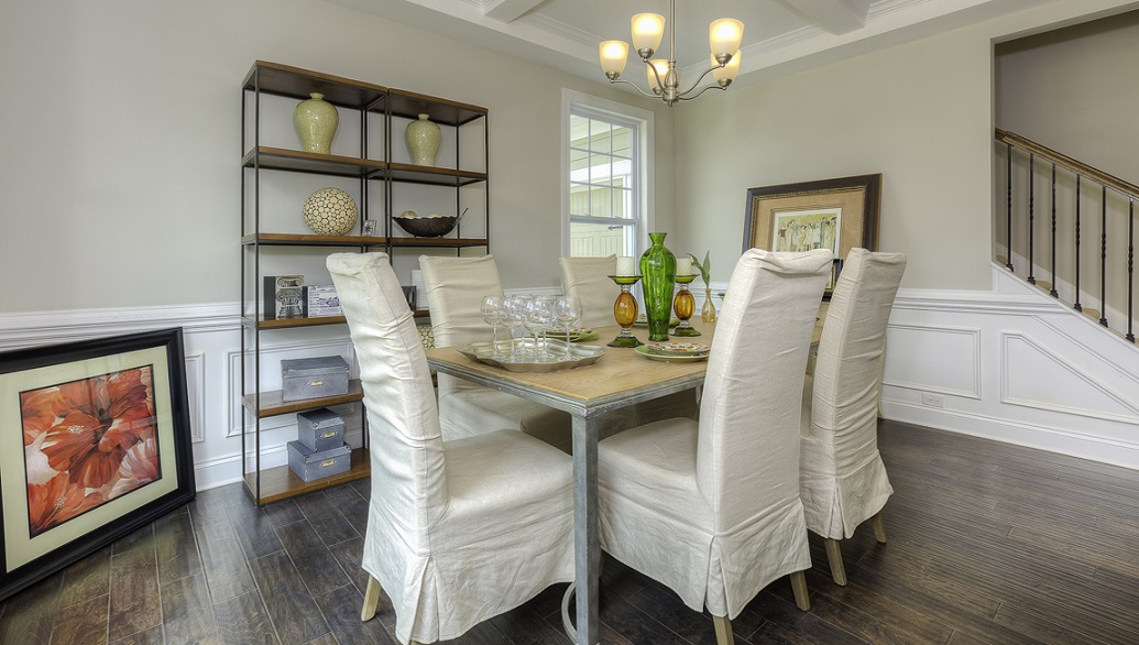 Dining room with wood floors and two large windows