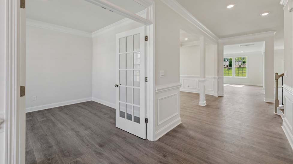 Welcoming foyer with wood floors