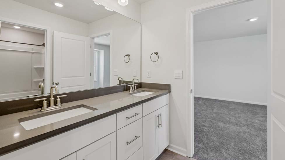 Bathroom with white cabinet and bathtub