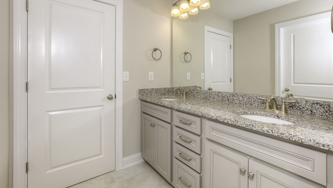 Bathroom with white cabinet and bathtub