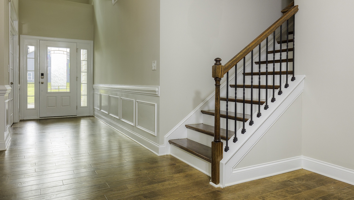 Welcoming foyer with wood floors