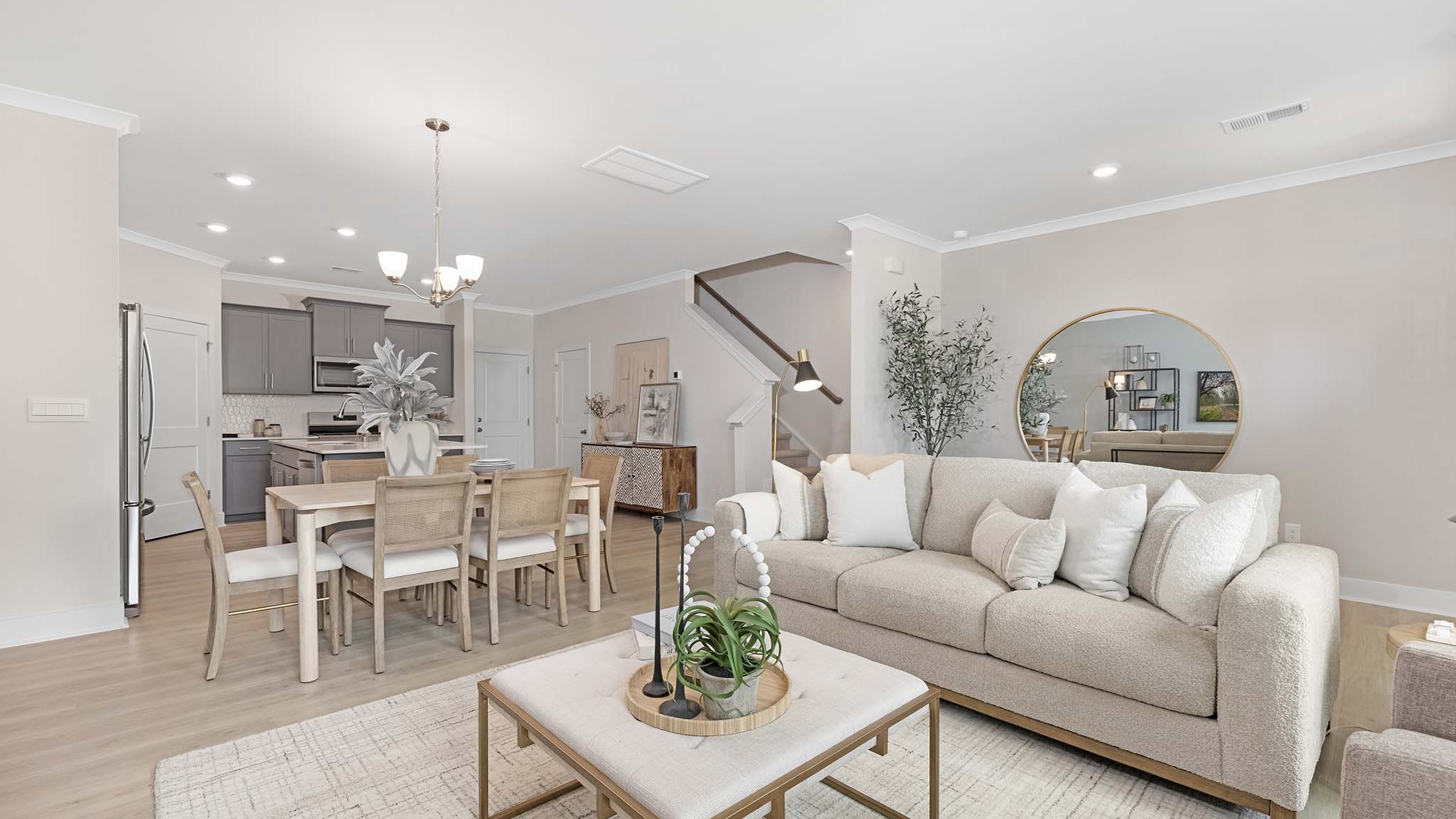Open living room beside kitchen and foyer