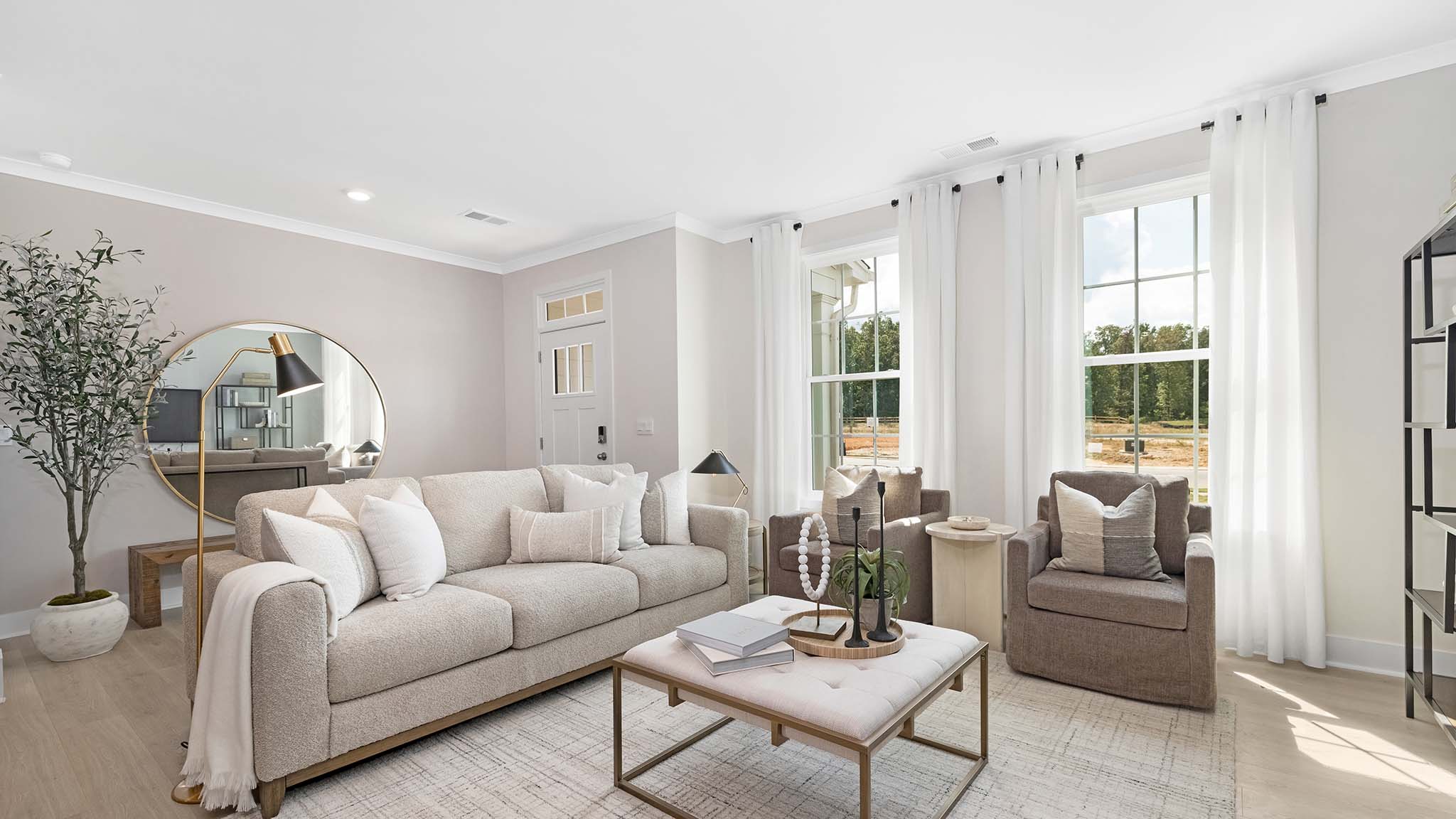 Open living room beside kitchen and foyer