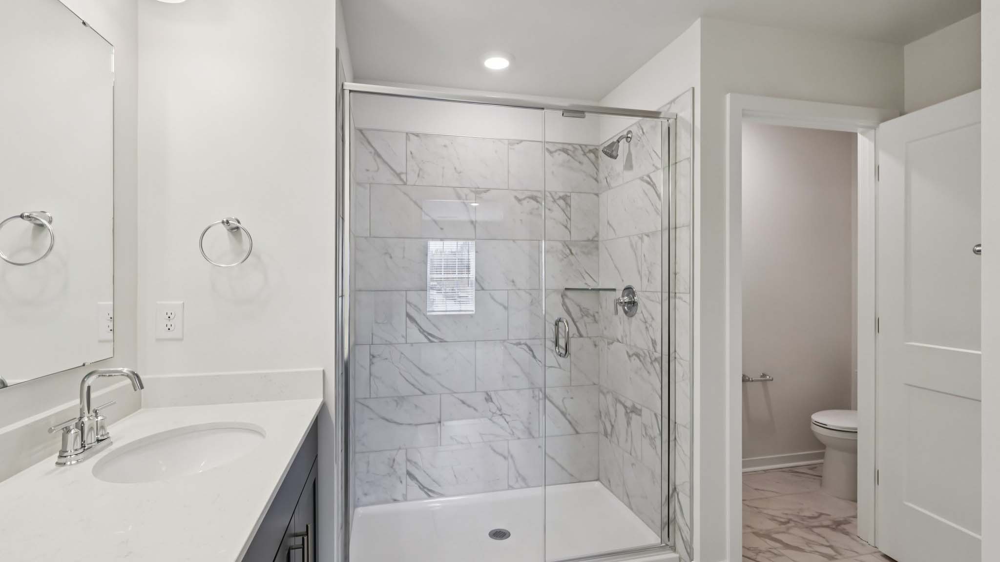 Primary bathroom with standing glass shower