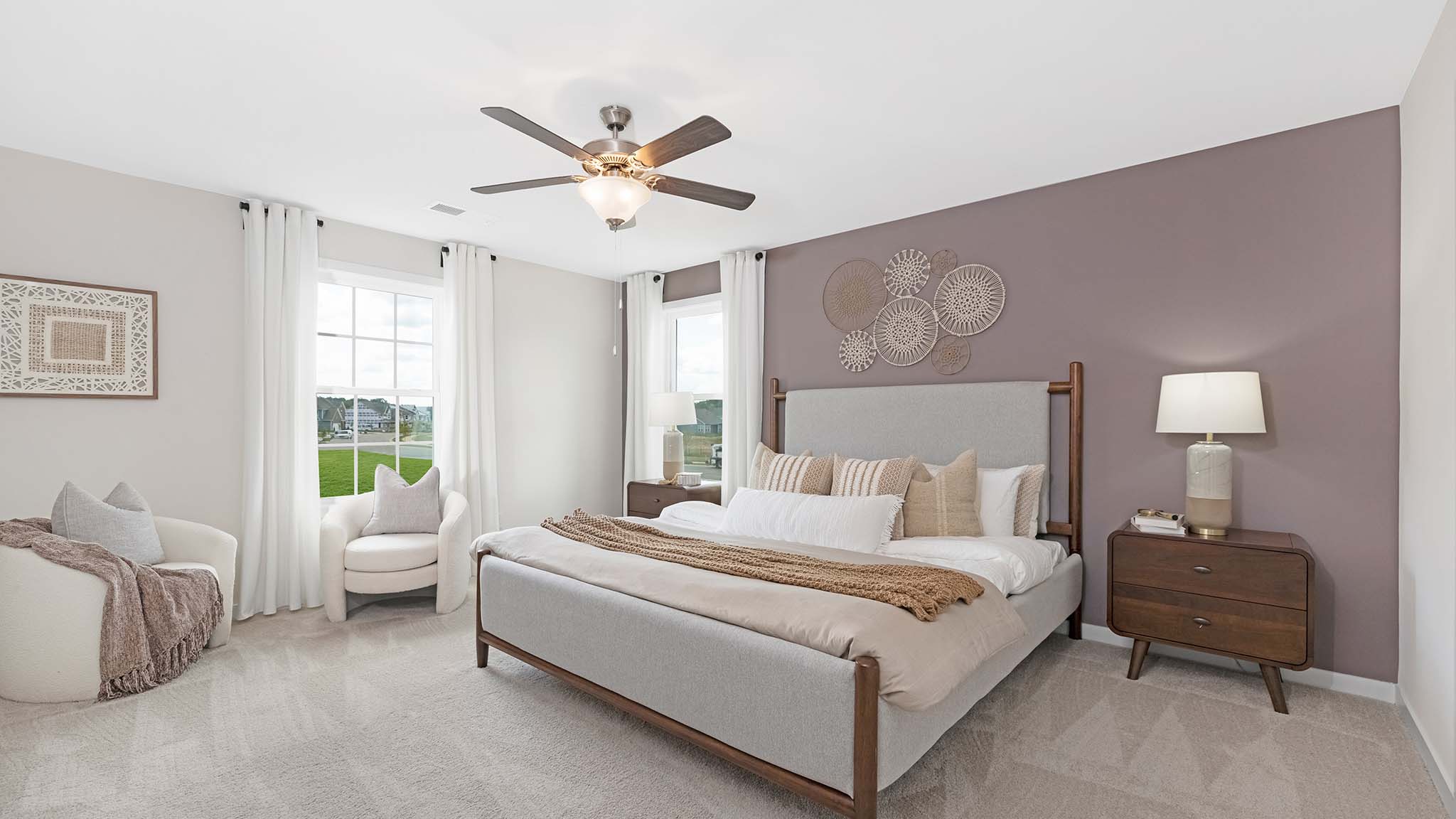 Carpeted bedroom with large window