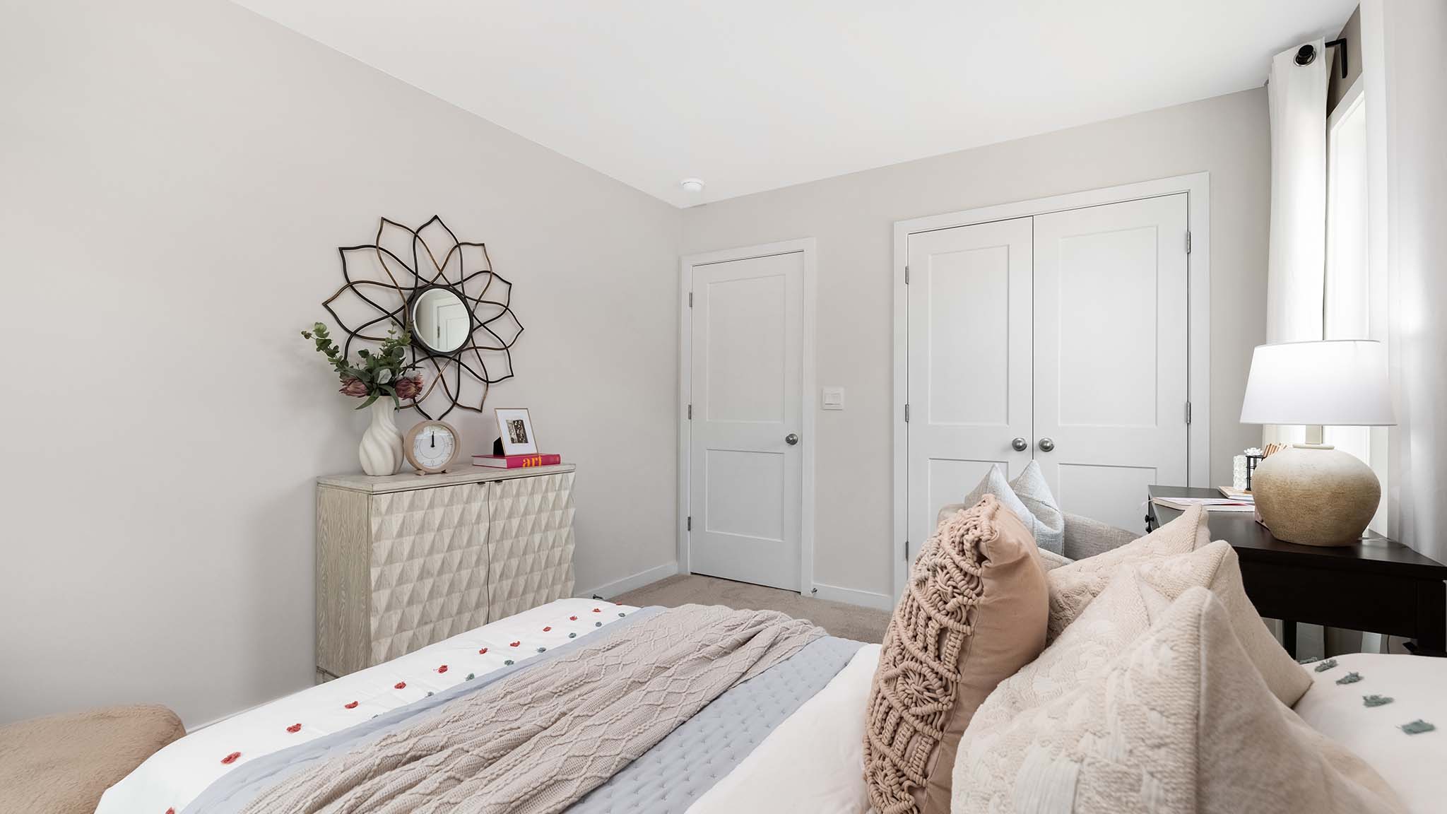 Carpeted bedroom with large window