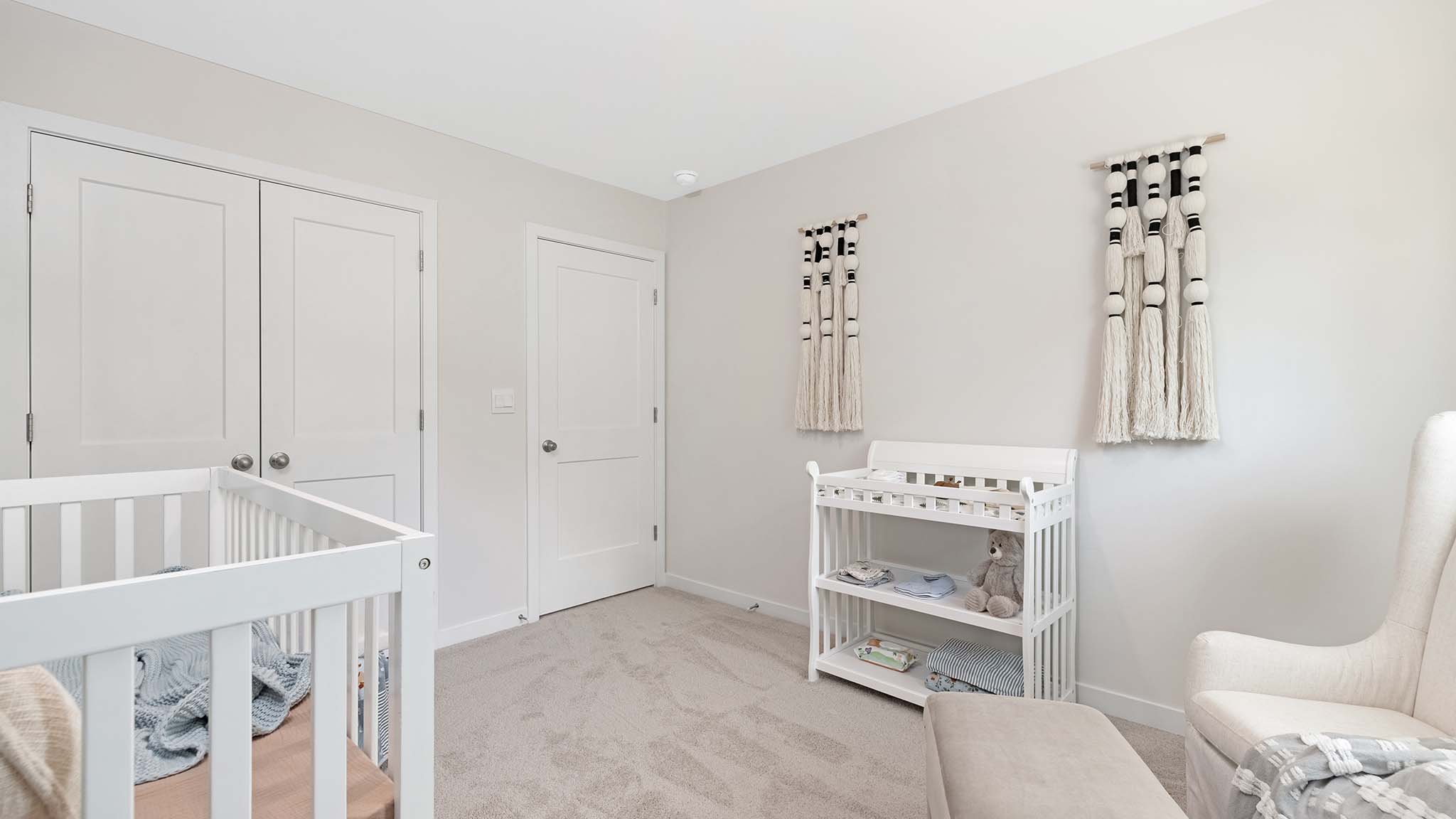 Carpeted bedroom with large window