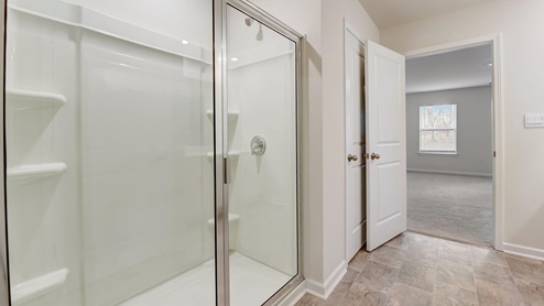 bathroom with glass door shower