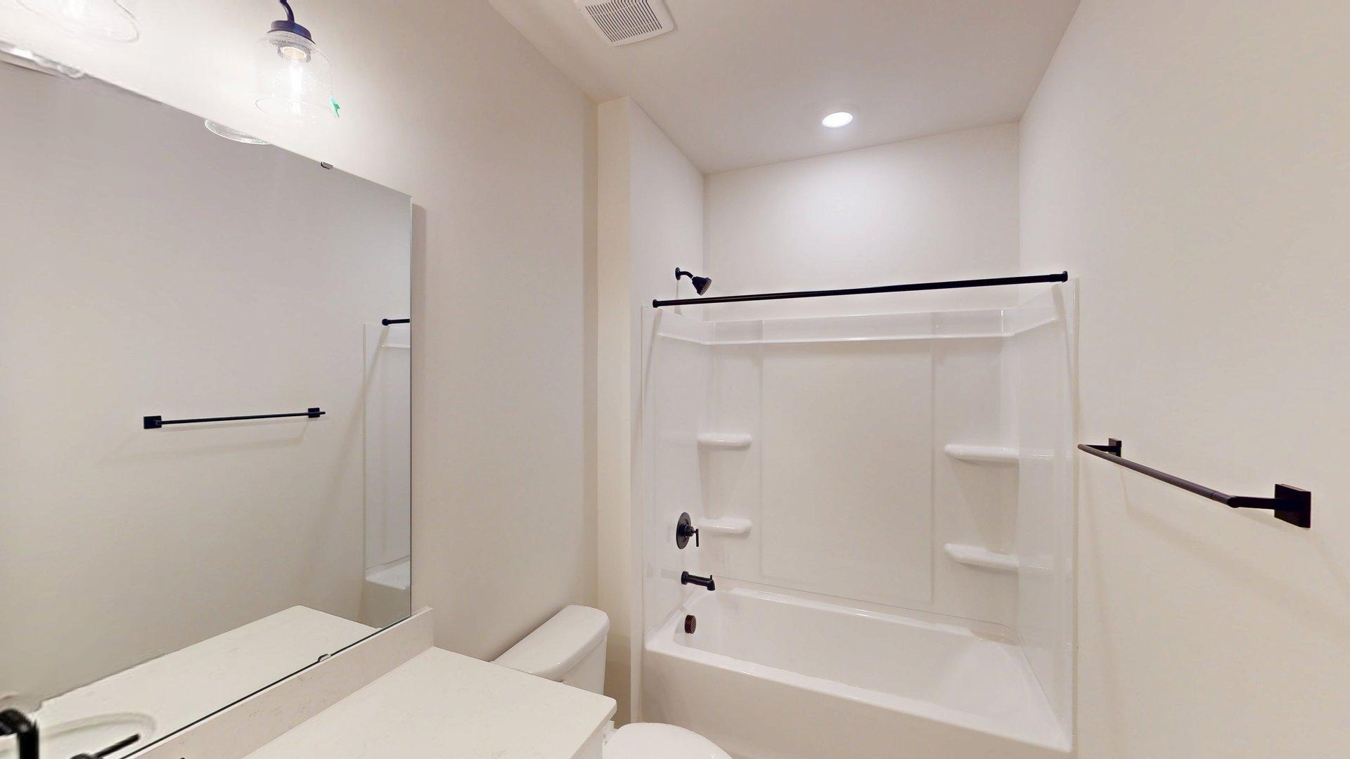 Bathroom with bathtub shower combination