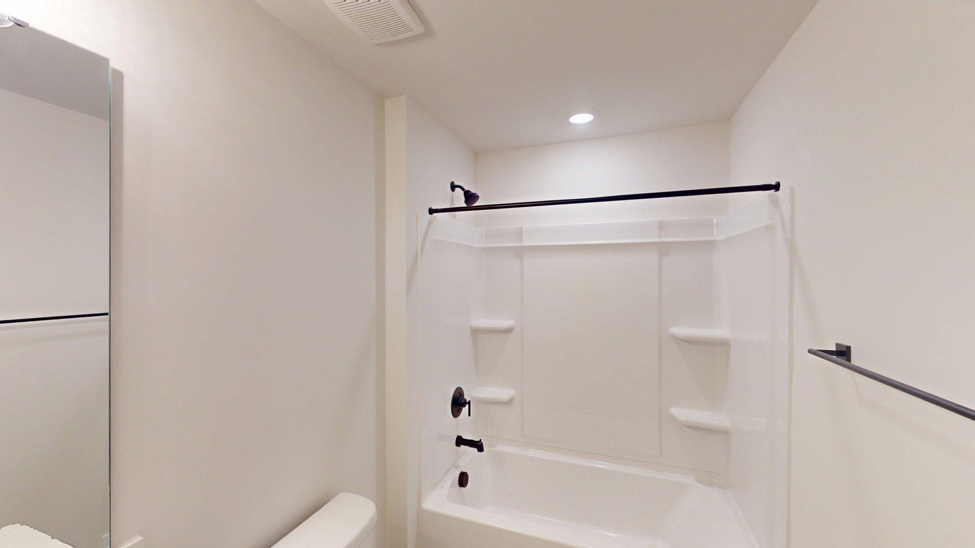 Bathroom with bathtub shower combination