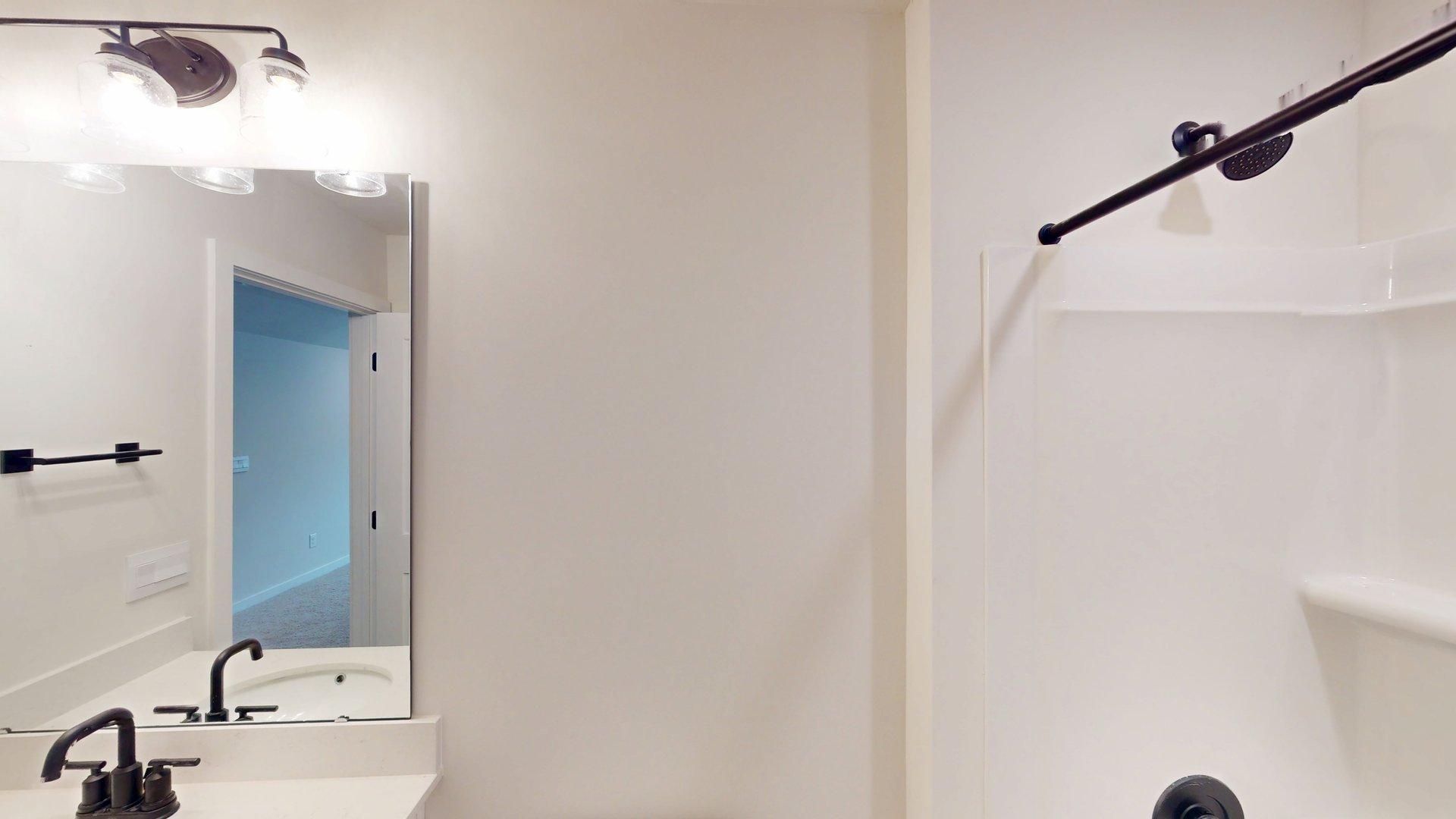 Bathroom with bathtub shower combination