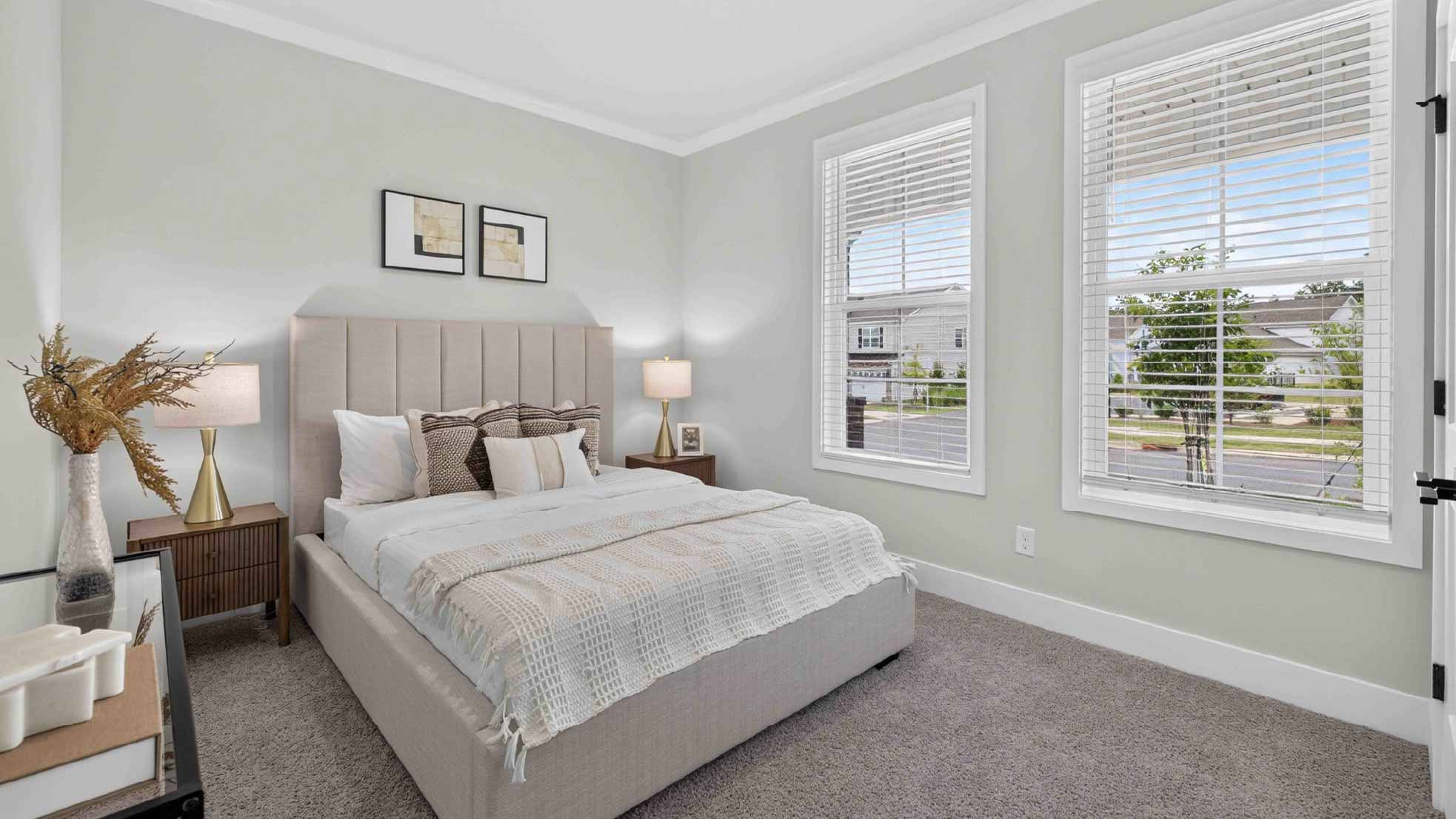 Carpeted bedroom with windows