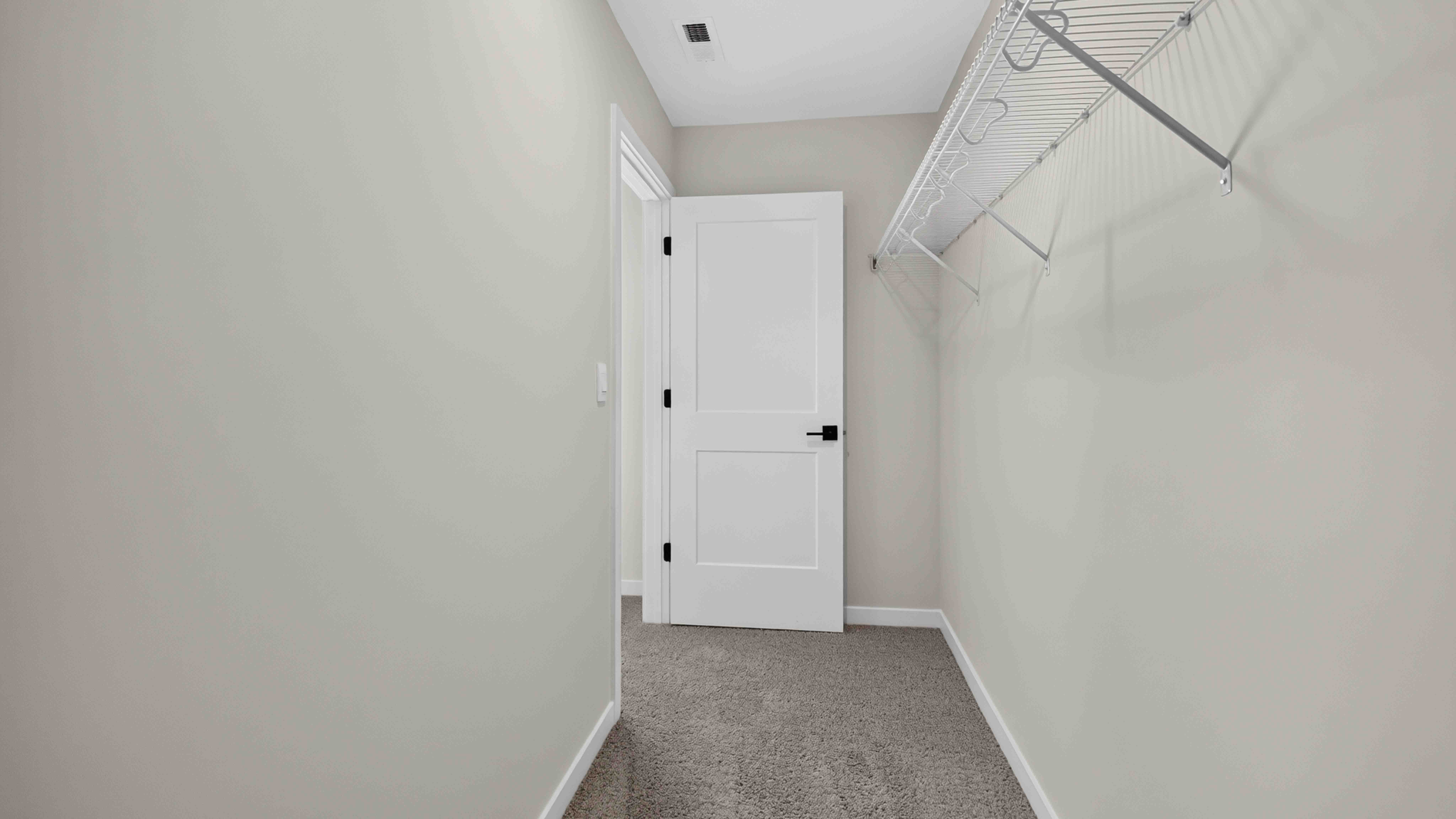 Carpeted walk in closet
