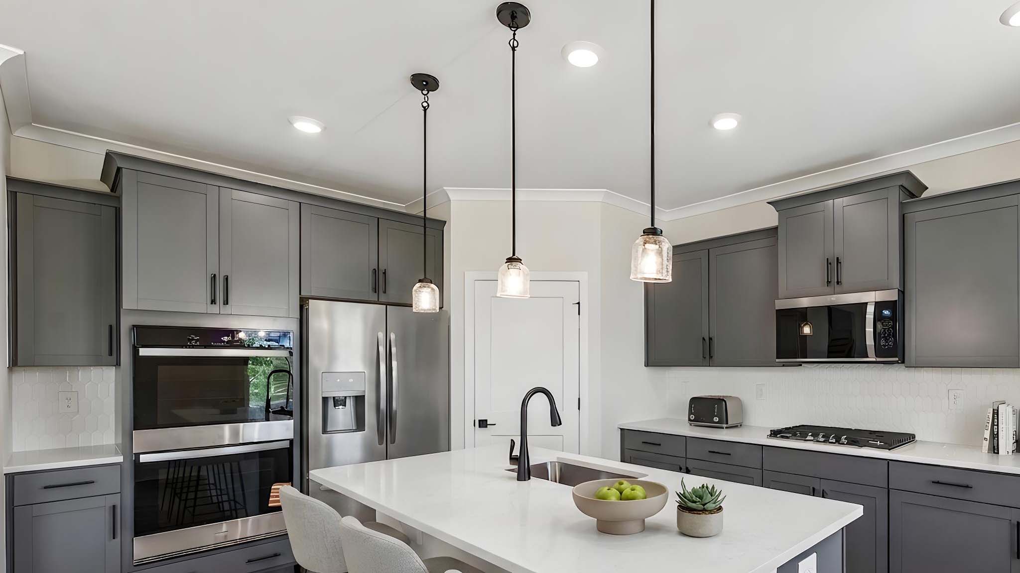 Kitchen and island with stainless steel appliances