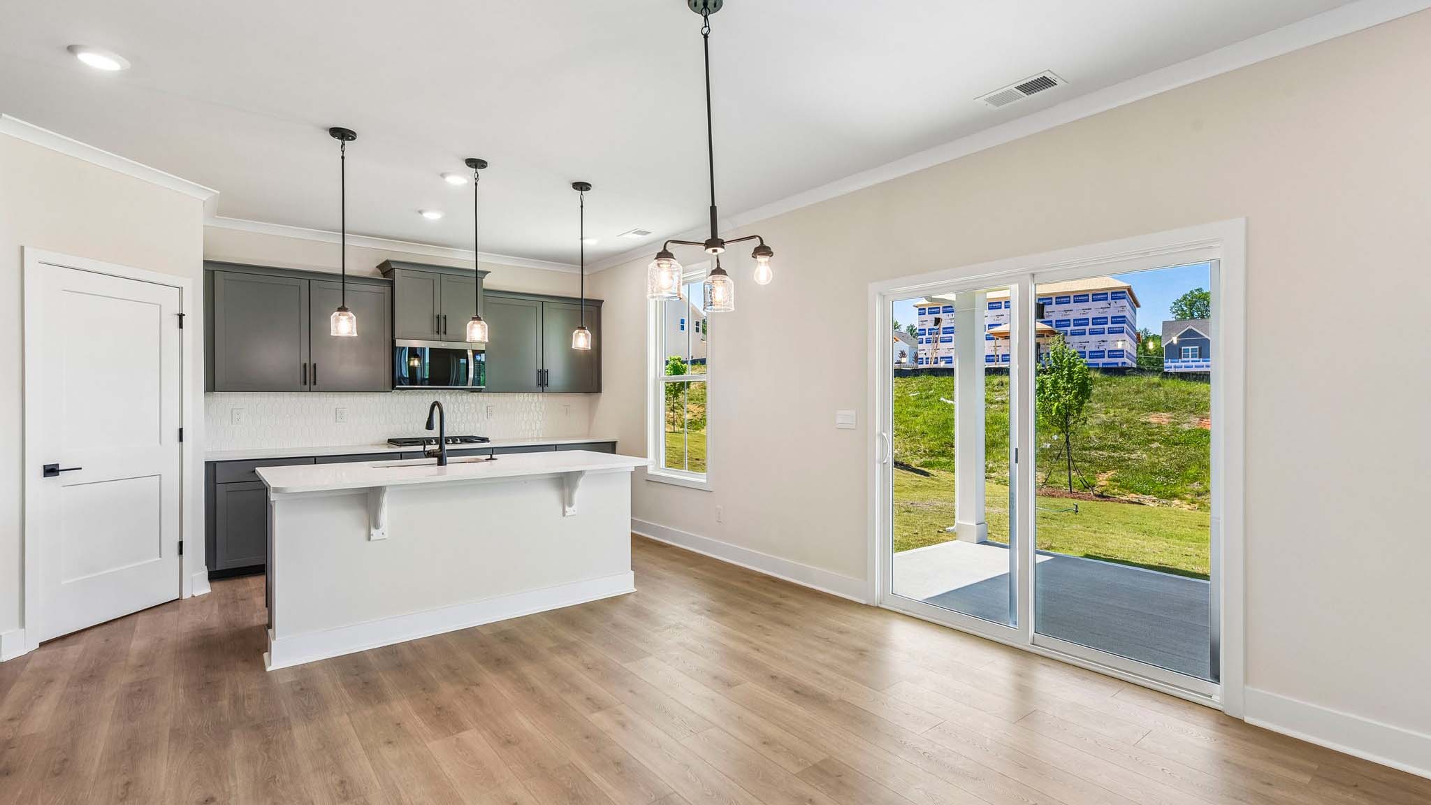 Kitchen and island with stainless steel appliances