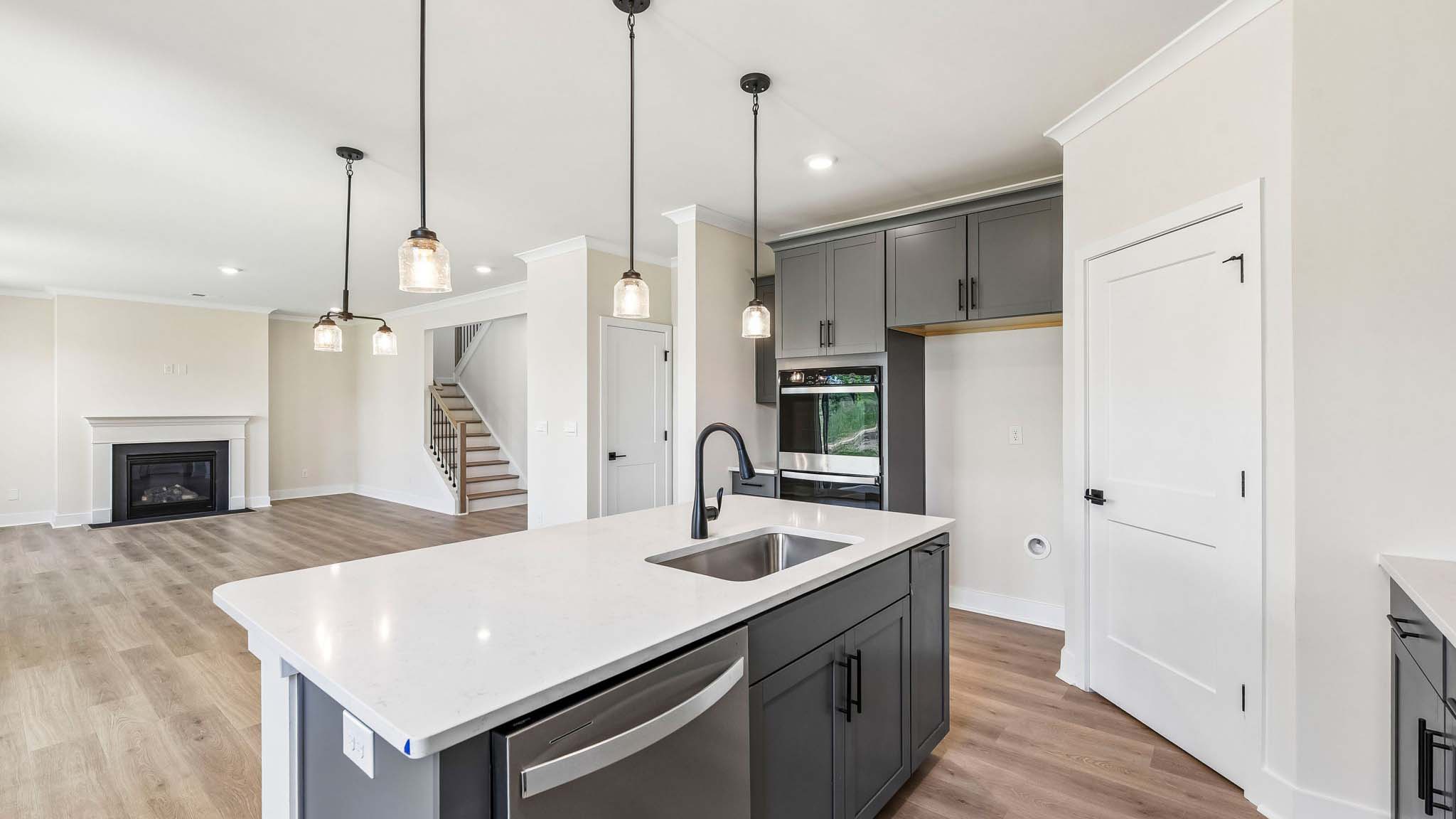 Kitchen and island with stainless steel appliances