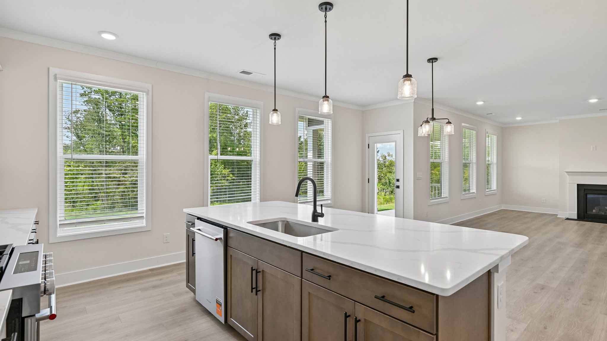 Kitchen and island with stainless steel appliances