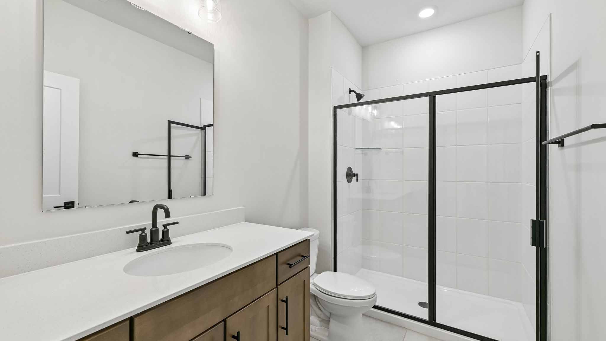 Bathroom with standing glass shower