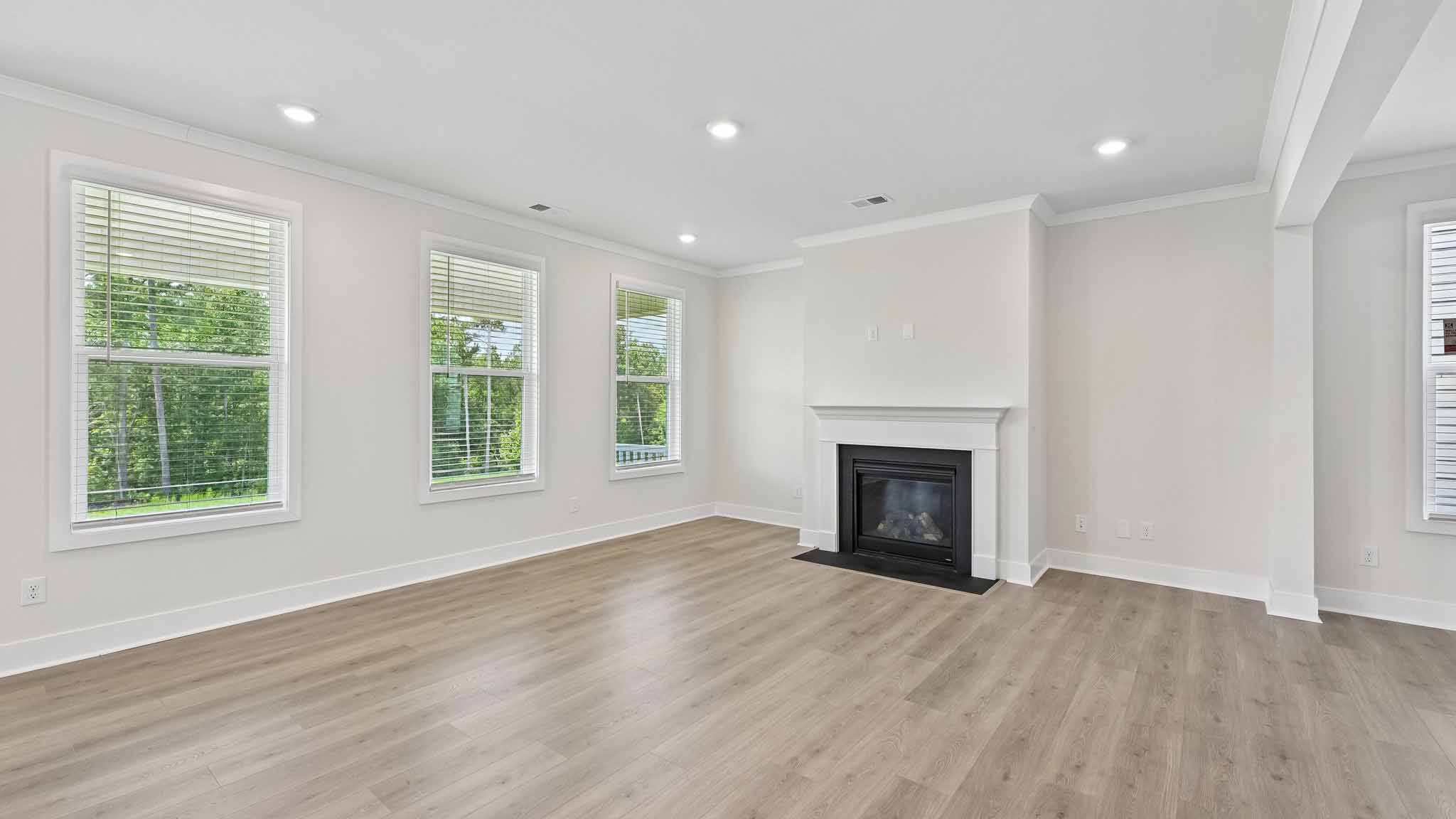 Living room with windows and fireplace