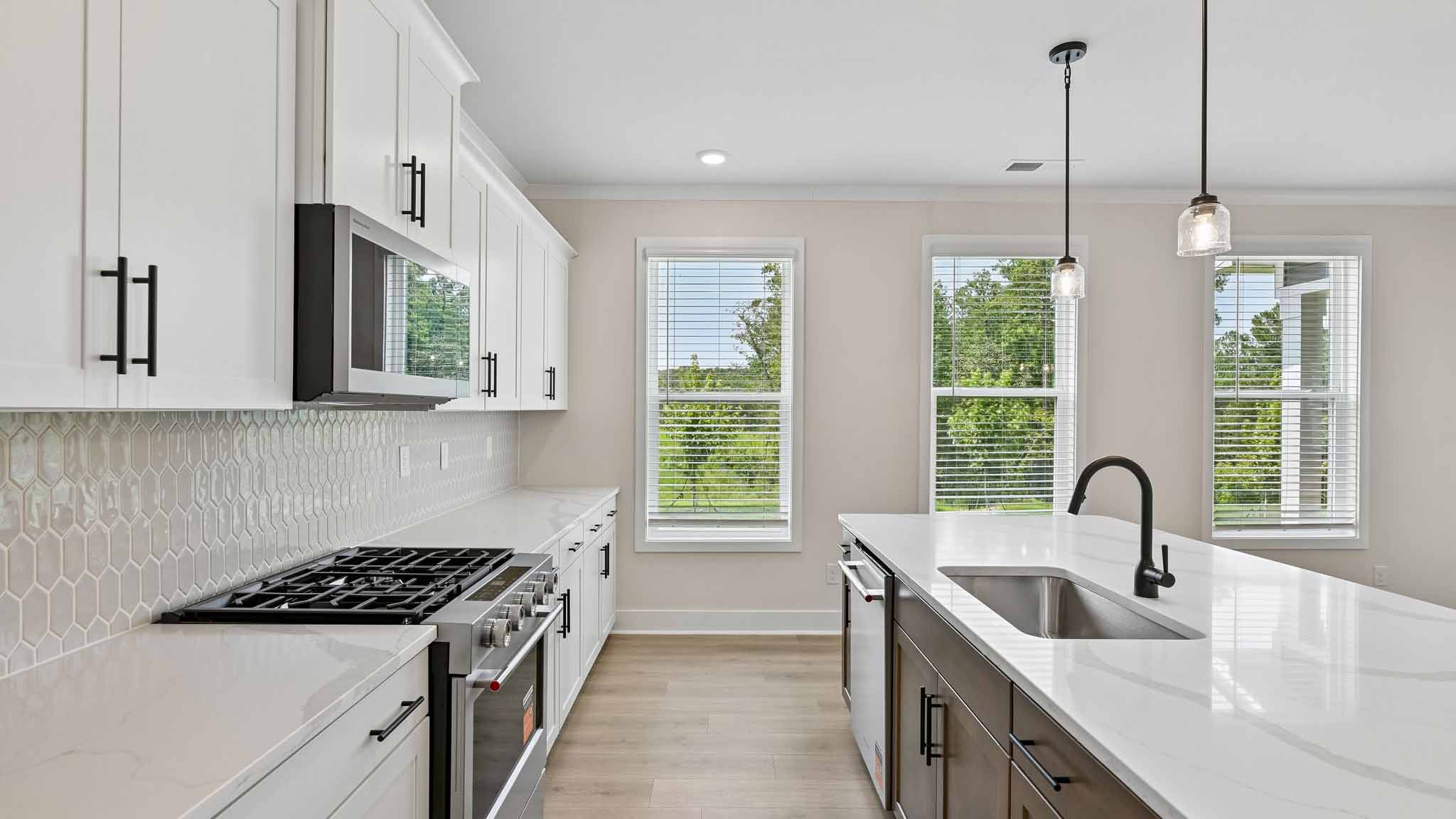 Kitchen and island with stainless steel appliances