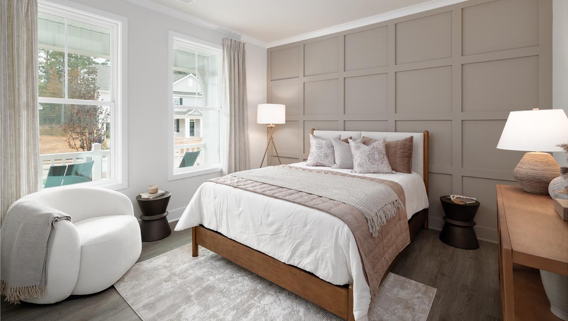 Hardwood bedroom with windows
