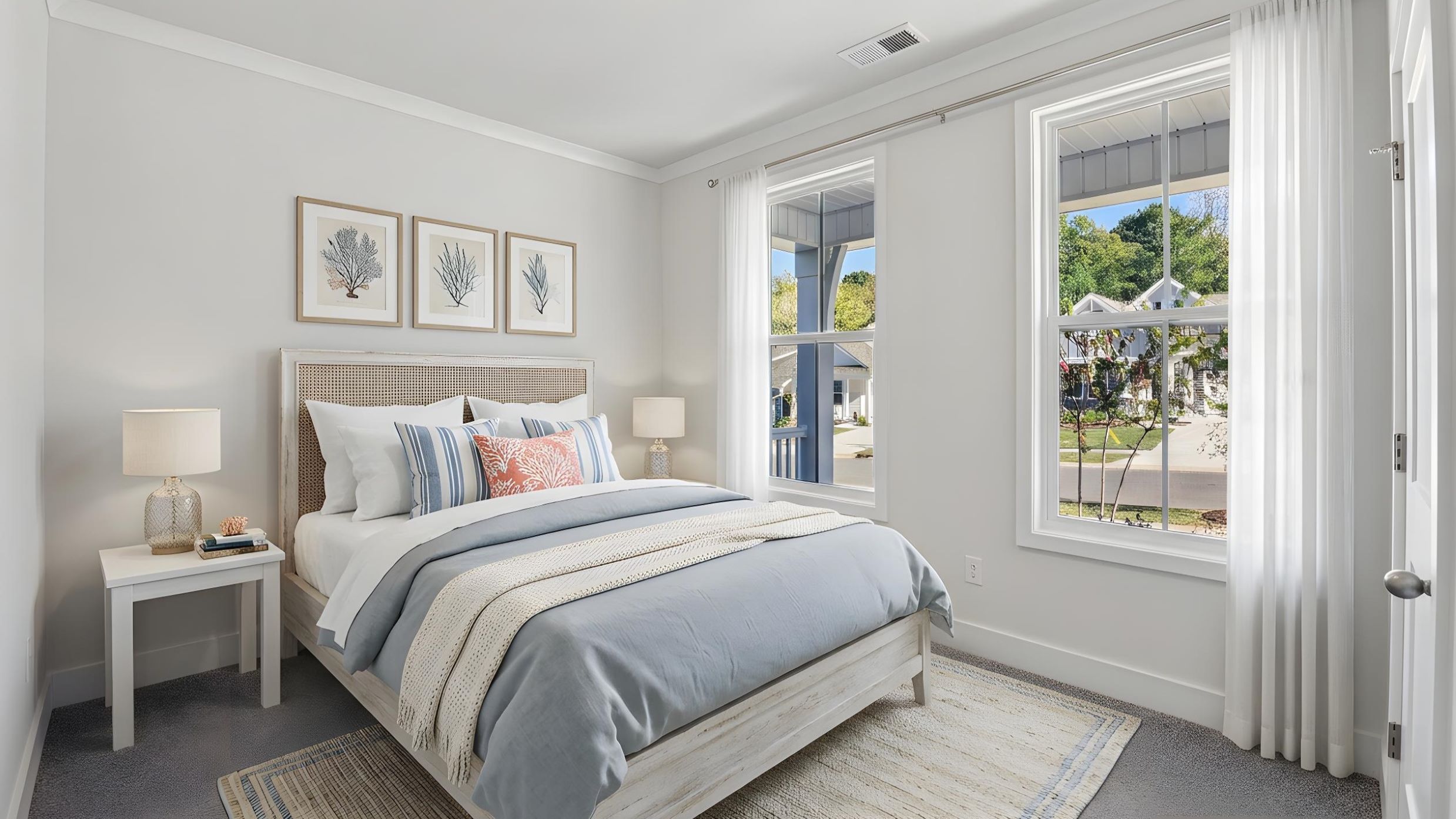 Carpeted bedroom with large window