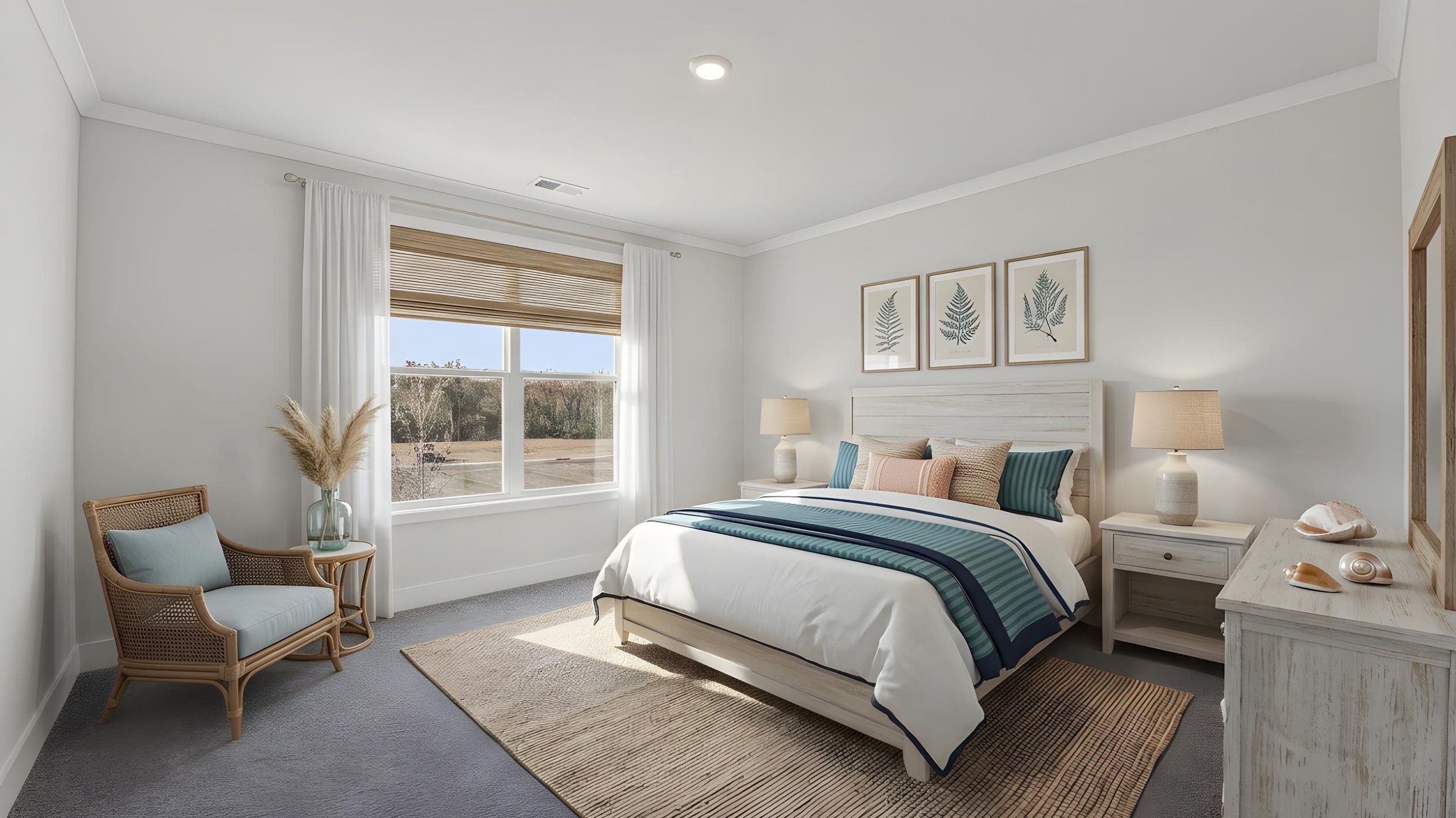 Primary bedroom with carpet and large window