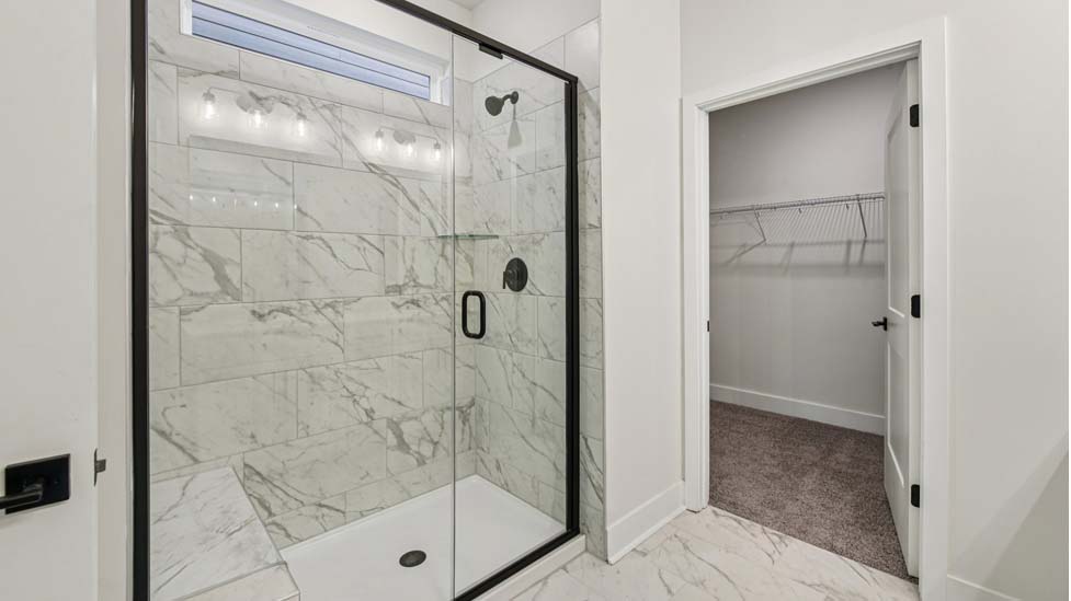 primary bath with standing glass shower