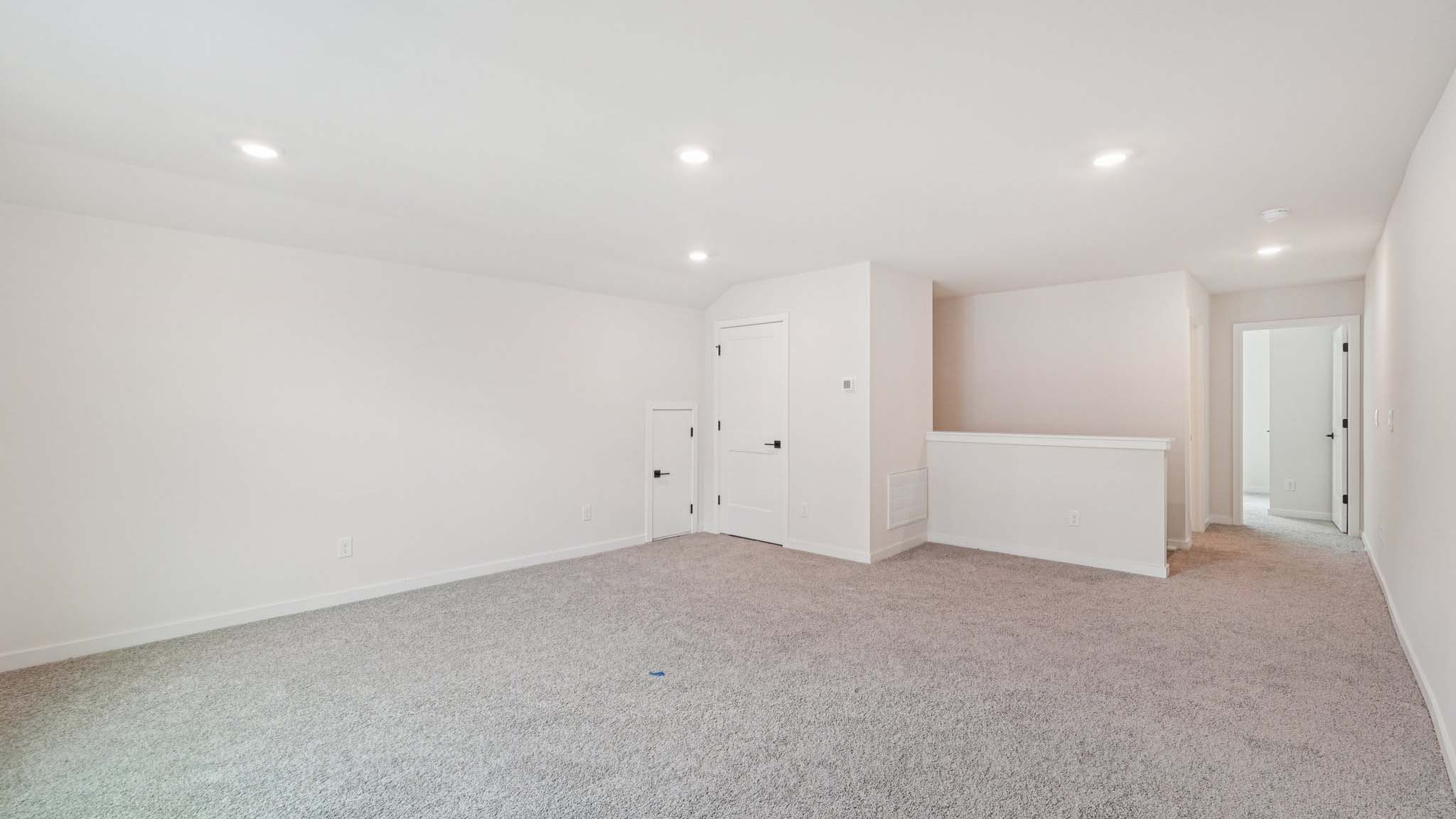 Upstairs carpeted loft