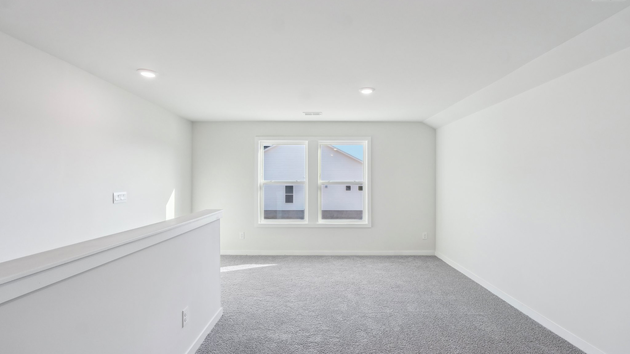 Upstairs carpeted loft